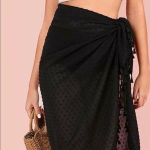 Black wrap coverup with tassel details